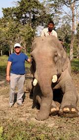 Rob Ament with the Kaziranga National Park Anti-Poaching Team. Rob stands beside team member and elephant