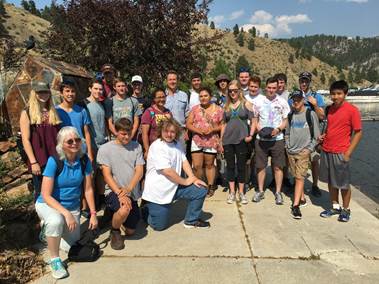 Montana Governor Steve Bullock (center) with STC students at Gates of the Mountain