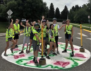 Group of student shows off painted traffic circle project in Bozeman Montana 2019