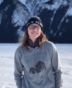 Outdoor portrait of student Maddy Pernat with winter landscape 2020