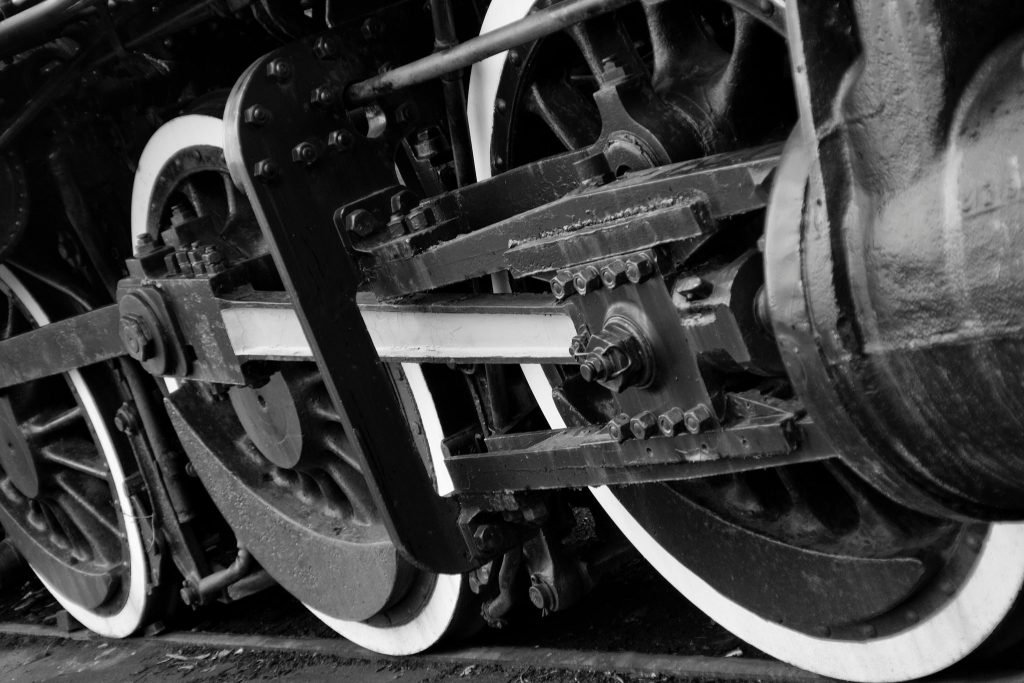 black and white image of train wheels