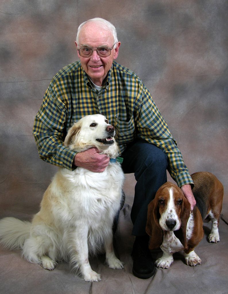 Portrait of Bill Jameson with his two dogs