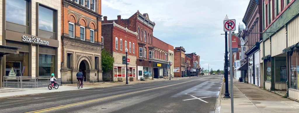 Quiet main street with two cyclists